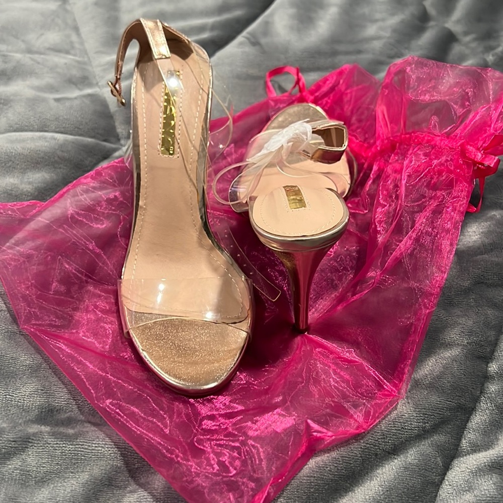 Brand new, never worn Rose Gold, clear strappy heels!